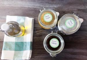 three containers of coffee on a wooden table at Moments Apartment in Dekani