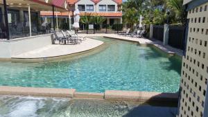 a swimming pool in the middle of a building at Nelson Bay Breeze in Nelson Bay