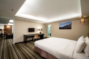 Postel nebo postele na pokoji v ubytování Yoyo Hotel