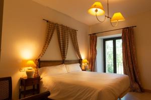 Postel nebo postele na pokoji v ubytování Hotel VillaMarcilla