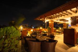 a table and chairs on a patio at night at Nivas Boutique Home in Kathmandu