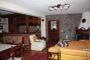 a bedroom with a bed and a living room at Villa Orlando in Bova Marina