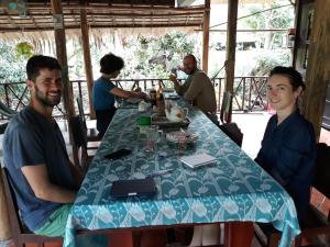 a group of people sitting around a table at Ngoc Phuong Homestay in Vĩnh Long