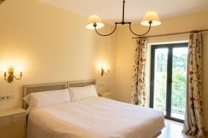 Postel nebo postele na pokoji v ubytování Hotel VillaMarcilla