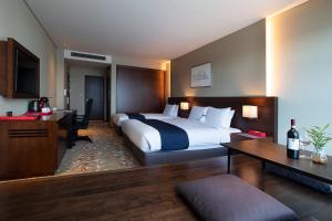Postel nebo postele na pokoji v ubytování ASTI Hotel Busan Station