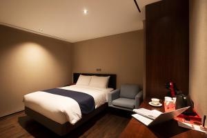 Postel nebo postele na pokoji v ubytování ASTI Hotel Busan Station