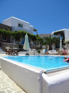 a swimming pool in front of a building at Ampelos in Chora Folegandros