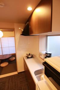 a kitchen with a sink and a counter top at Sakura Stay Yoga 301 in Tokyo +22 photos