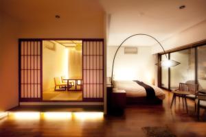 Postel nebo postele na pokoji v ubytování Hanare Matsushimakaku