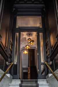 a view of a staircase with chandeliers at B in Antwerp in Antwerp