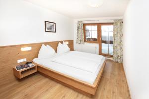 Posteľ alebo postele v izbe v ubytovaní Tarlack Appartements Hütten 34