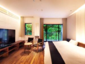TV a/nebo společenská místnost v ubytování Hanare Matsushimakaku