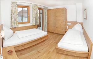 Posteľ alebo postele v izbe v ubytovaní Tarlack Appartements Hütten 34