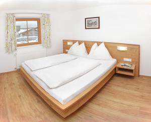 Posteľ alebo postele v izbe v ubytovaní Tarlack Appartements Hütten 34
