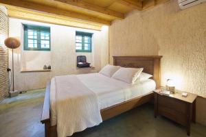 Postel nebo postele na pokoji v ubytování Athenian Residences