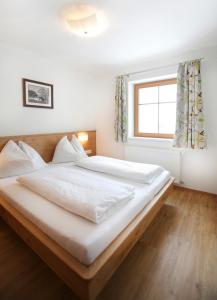 Posteľ alebo postele v izbe v ubytovaní Tarlack Appartements Hütten 34