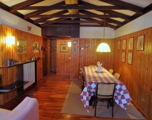 a dining room with a table and chairs at Appartamento La Primula in Madesimo