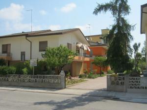 a house on the side of a street at Flavia Flats in Bibione