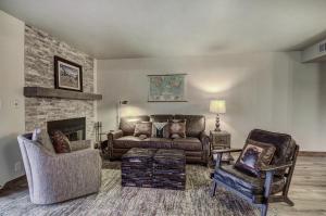 a living room with a couch and a fireplace at 241C Mountain Side Condo in Frisco