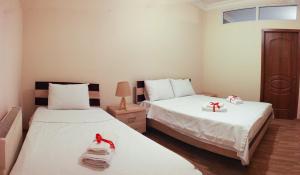 Postel nebo postele na pokoji v ubytování Hotel Tao