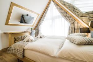 Posteľ alebo postele v izbe v ubytovaní Mountain Apartments Jagiellońska Residence