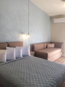 Posteľ alebo postele v izbe v ubytovaní Panas Hotel