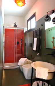 a bathroom with a shower and a tub and a sink at moon's fault - tutta colpa della luna in Pozzuoli