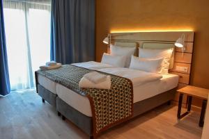 Postel nebo postele na pokoji v ubytování Walhalla Hotel Regensburg Hoeferer 4 Sterne Superior