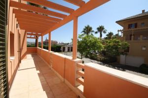 a balcony with a view of the street at Sotogrande - SotoLUX in Sotogrande