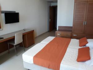 Postel nebo postele na pokoji v ubytování El Greco Hotel