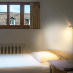 Postel nebo postele na pokoji v ubytování Château de Bossey
