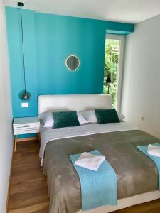 Postel nebo postele na pokoji v ubytování Deluxe Suites Mandić