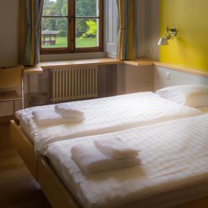 Postel nebo postele na pokoji v ubytování Château de Bossey