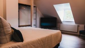 Postel nebo postele na pokoji v ubytování Hotel Palmenbad