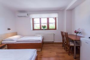 Postel nebo postele na pokoji v ubytování Penzion Leknín