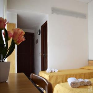 Postel nebo postele na pokoji v ubytování Hotel Admiral