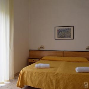 Postel nebo postele na pokoji v ubytování Hotel Admiral
