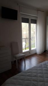 Postel nebo postele na pokoji v ubytování Albergo al lago