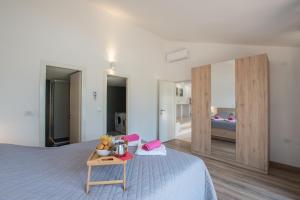 Postel nebo postele na pokoji v ubytování Villa Mira