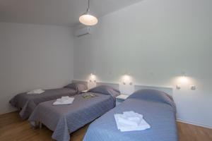 Postel nebo postele na pokoji v ubytování Villa Mira