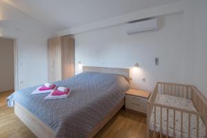 Postel nebo postele na pokoji v ubytování Villa Mira