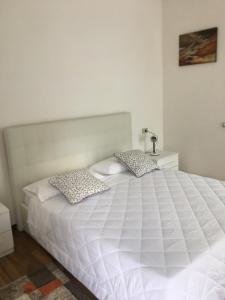 Postel nebo postele na pokoji v ubytování Albergo al lago