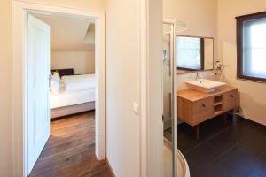 Łóżko lub łóżka w pokoju w obiekcie Hotel Gerl