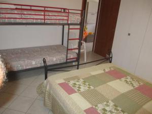 Posteľ alebo postele v izbe v ubytovaní SoleMare Sud Sardegna