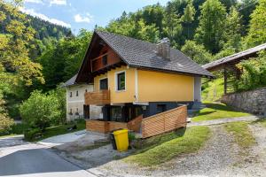 a small house in the middle of a mountain at Cosy Apartment Pr Potokar in Podlonk