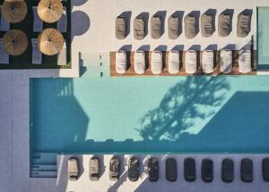 an overhead view of a swimming pool with pairs of shoes at Contessina Hotel in Tsilivi