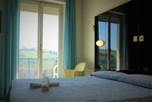 Postel nebo postele na pokoji v ubytování Grand Hotel Excelsior