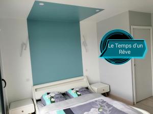 Ένα ή περισσότερα κρεβάτια σε δωμάτιο στο Le Temps d'un Rêve