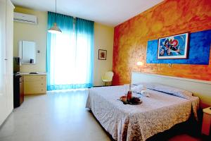 Postel nebo postele na pokoji v ubytování Grand Hotel Excelsior
