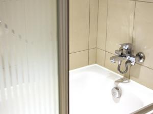 A bathroom at The Parma Hotel Downtown